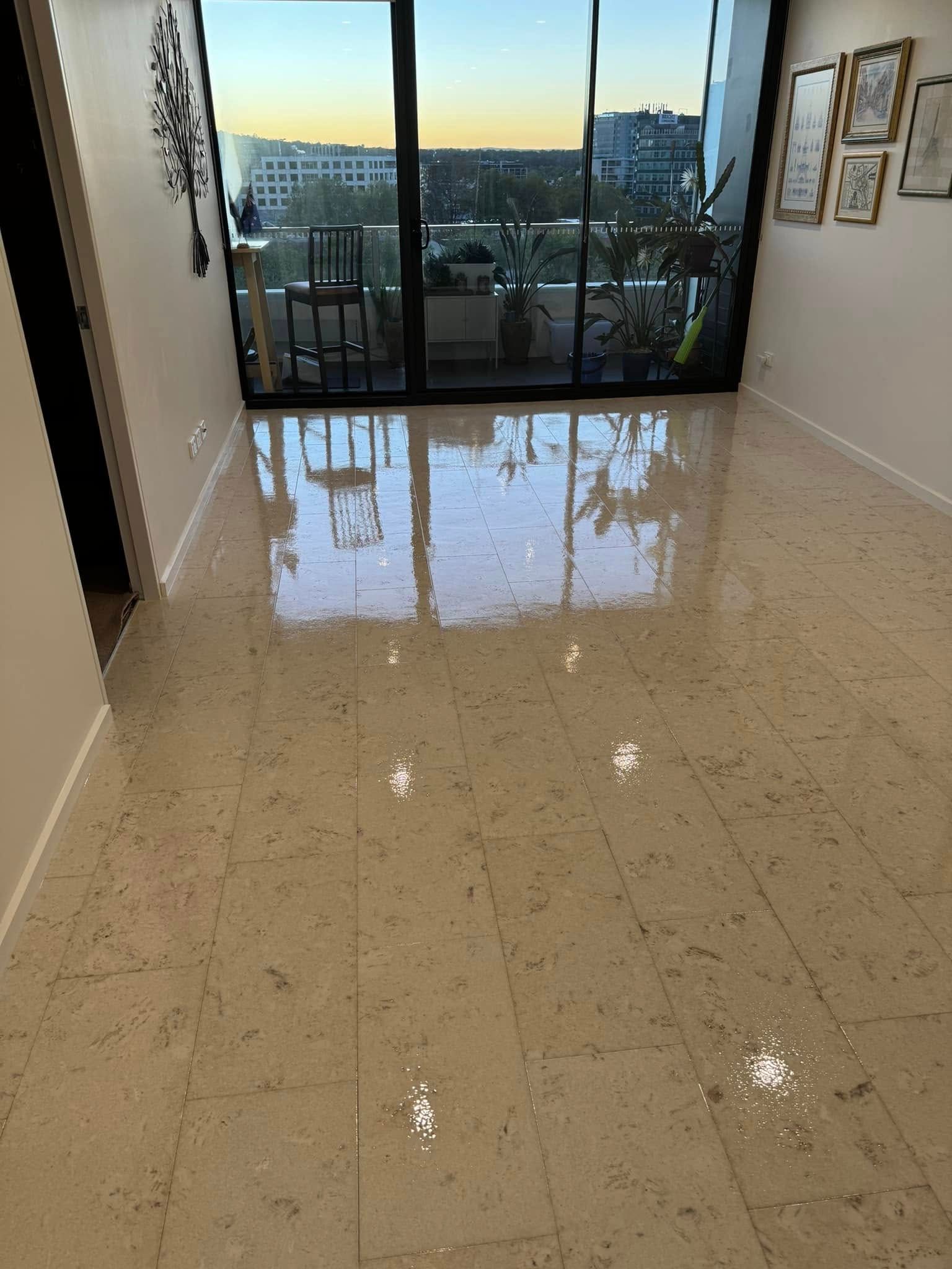 Light-Coloured Tiled Floor Reflects Sunlight and A Balcony, Near a Glass Door — Canberra Floor Coverings in Queanbeyan West, NSW