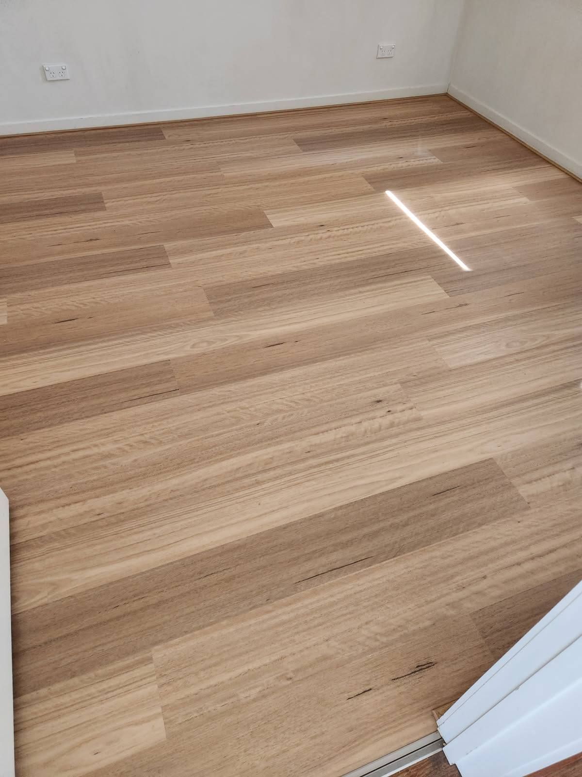 Wooden Floorboards in A Room, Pale Brown Colour — Canberra Floor Coverings in Queanbeyan West, NSW