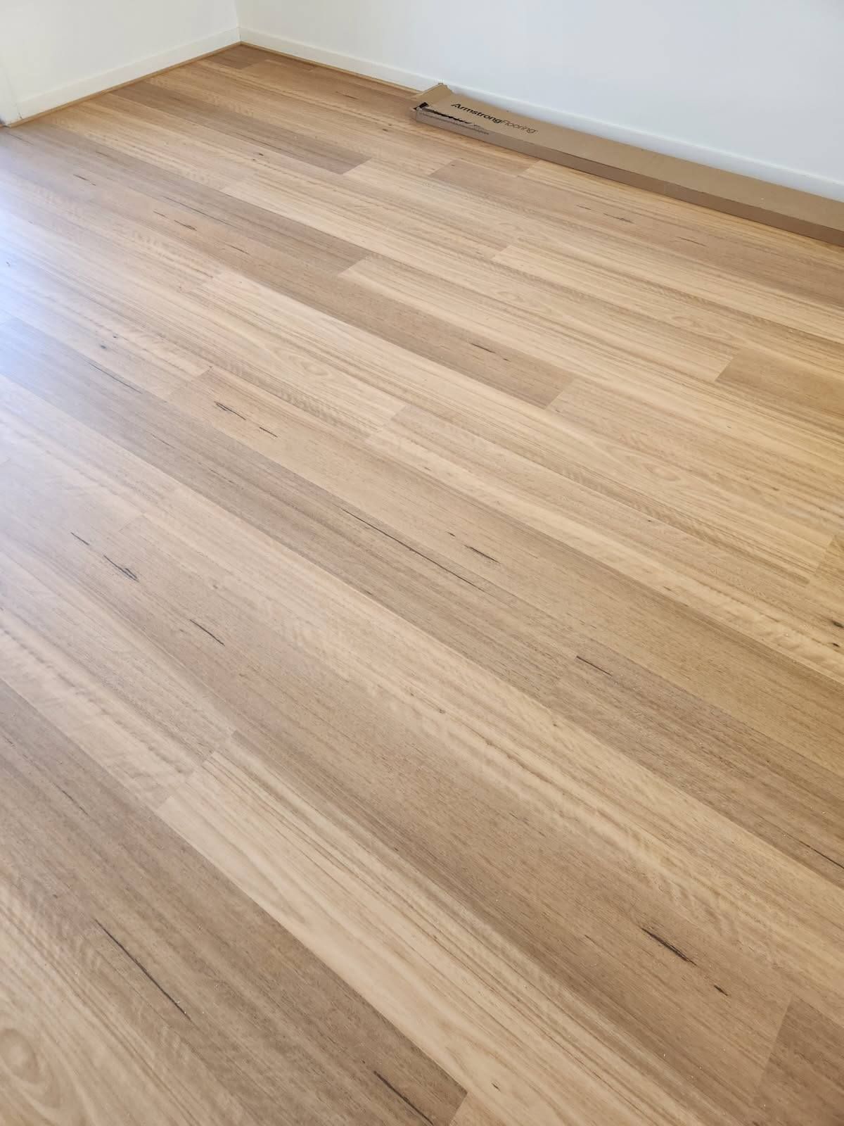 Light Brown Wooden Floorboards in A Room, with A White Wall in The Corner — Canberra Floor Coverings in Queanbeyan West, NSW