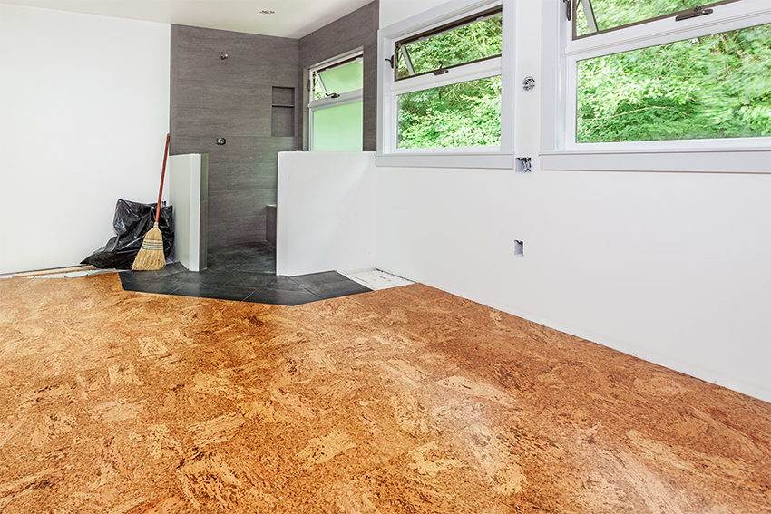 A Room With a Cork Floor and a Broom — Canberra Floor Coverings in Bungendore, NSW