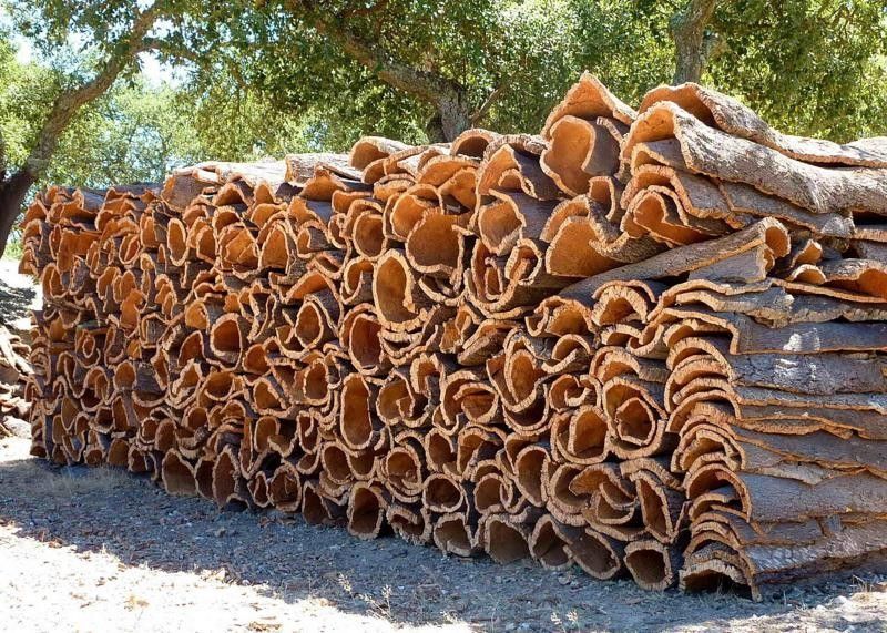 Stacks of Harvested Cork Bark, Tan and Grey, Outdoors — Canberra Floor Coverings in Queanbeyan West, NSW