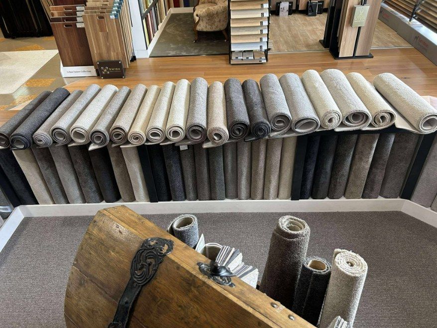 Rows of Rolled Carpets in Various Neutral Colours — Canberra Floor Coverings in Queanbeyan West, NSW
