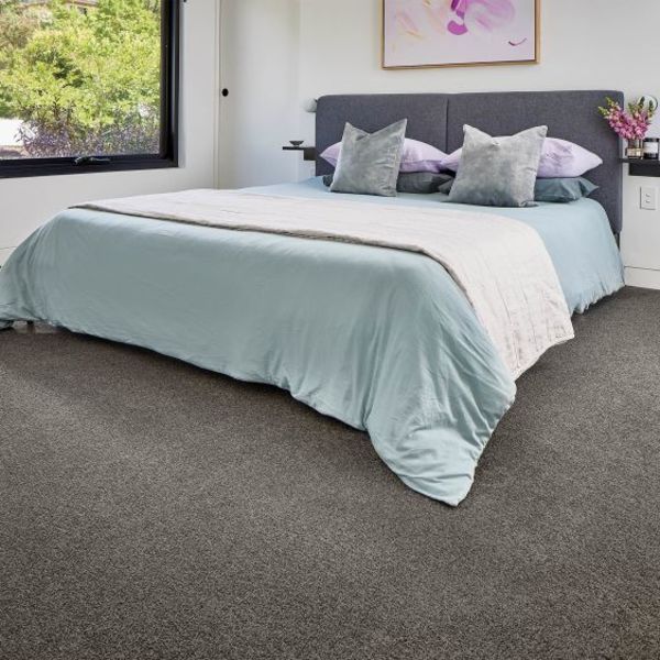 Bedroom With a Bed Covered in Blue and Grey Carpet — Canberra Floor Coverings in Googong, NSW