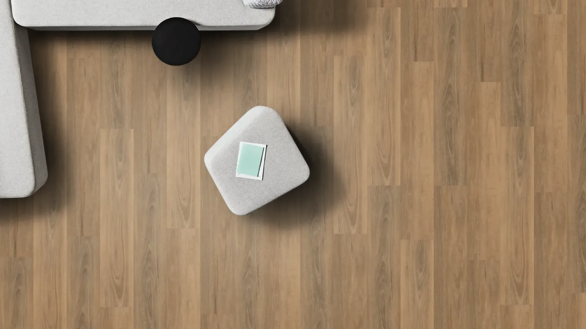 Overhead View: Light-Coloured Couch, Wooden Floor — Canberra Floor Coverings in Queanbeyan West, NSW