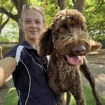 A Woman Is Taking A Selfie With Her Dog — Yeppoon Boarding Kennels & Cattery In Farnborough, QLD