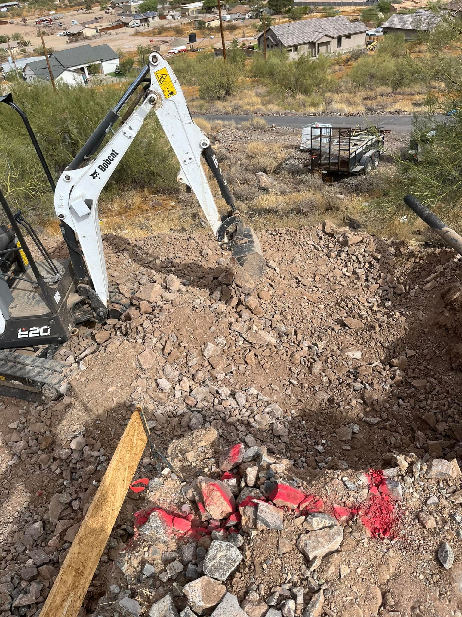 A bulldozer is digging a hole in the ground.