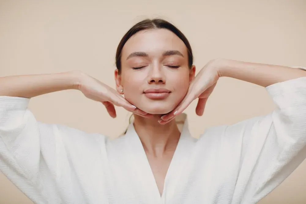 woman doing face building facial gymnastics