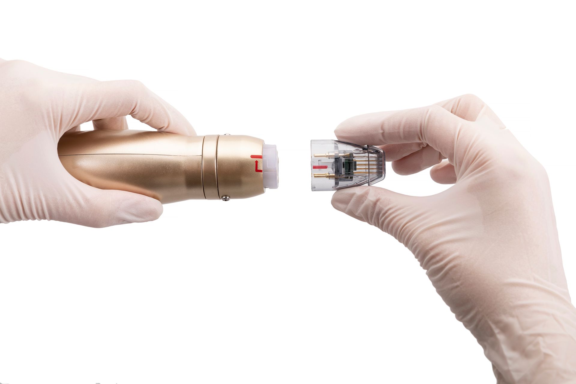 A person wearing gloves is holding a device in their hands.