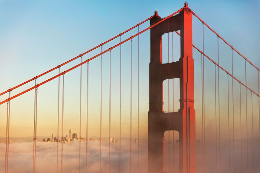 The golden gate bridge in san francisco is covered in fog