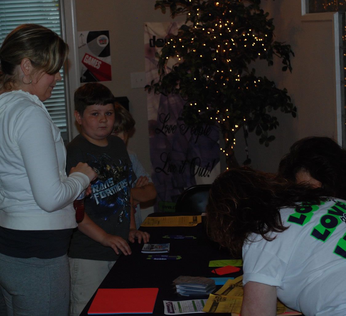 A woman wearing a shirt that says love on it