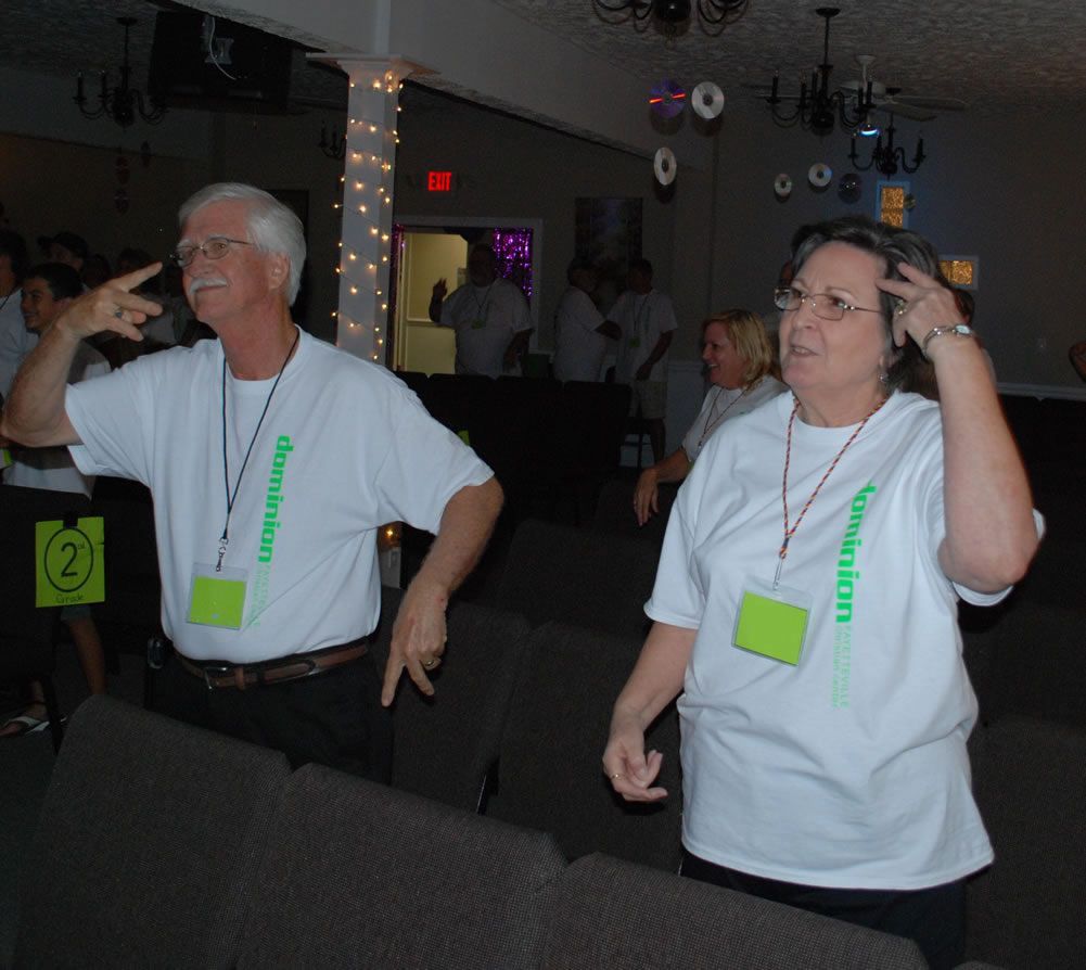 A man and a woman are wearing shirts that say donation