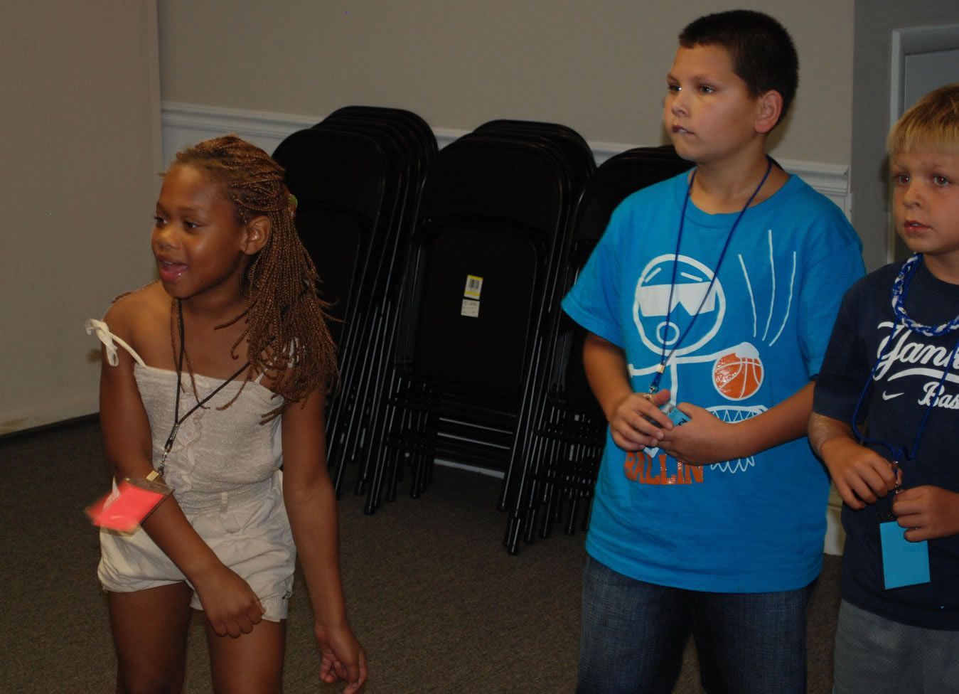 three children listening intently