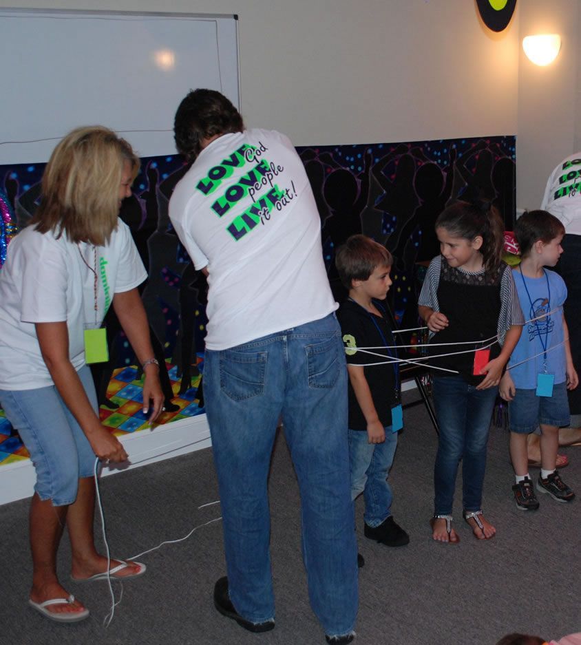 A man wearing a white shirt that says love love life