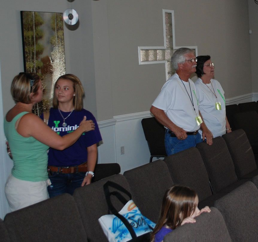 A woman wearing a shirt that says dominion on it