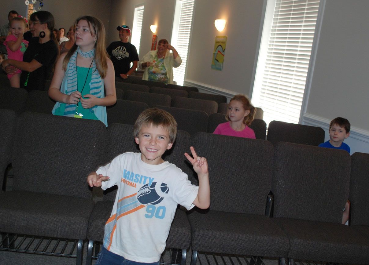A boy wearing a shirt with the number 90 on it