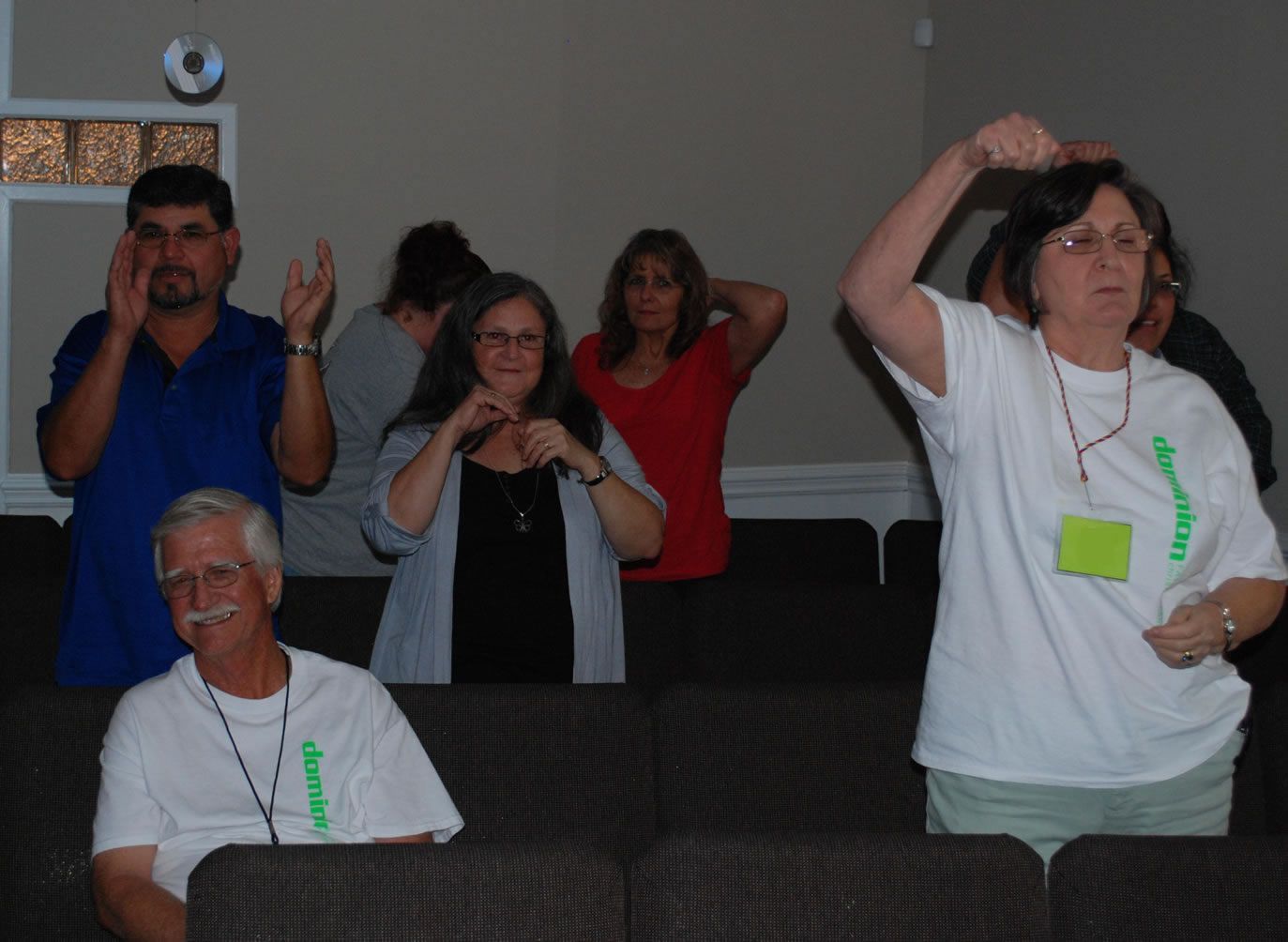 A group of people wearing white shirts with the word inspire on them