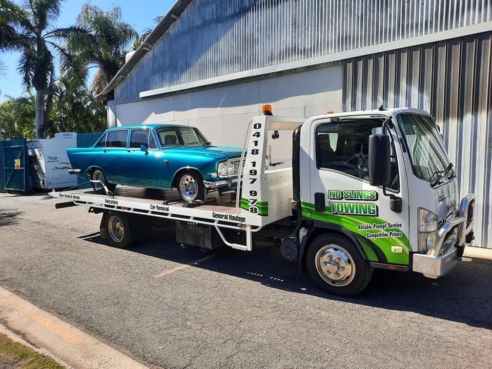 Blue Classic Car on a Tow Truck, Parked in Front of a Building — No Slings Towing in Glendale, QLD