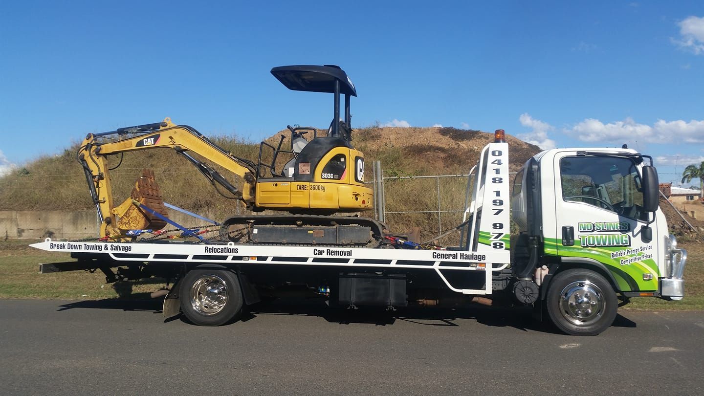 Mini Excavator on a Flatbed Truck on a Road — No Slings Towing in Glendale, QLD