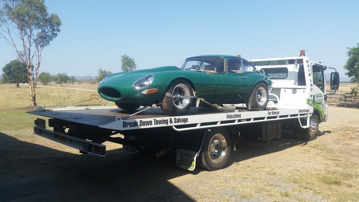 Green Jaguar E-type Convertible on a Flatbed Tow Truck, Outdoors — No Slings Towing in Glendale, QLD