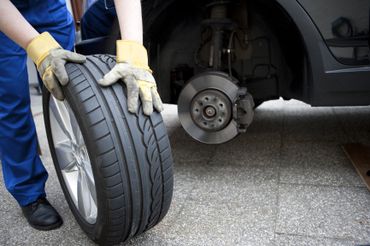 car mechanic changing a car's tires