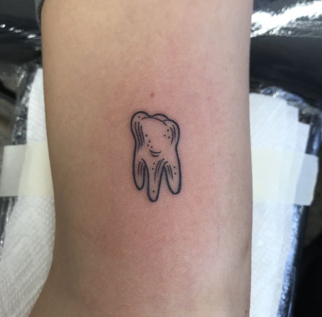 Miley Cyrus Little Tooth Tattoo on Her Elbow PopStarTats