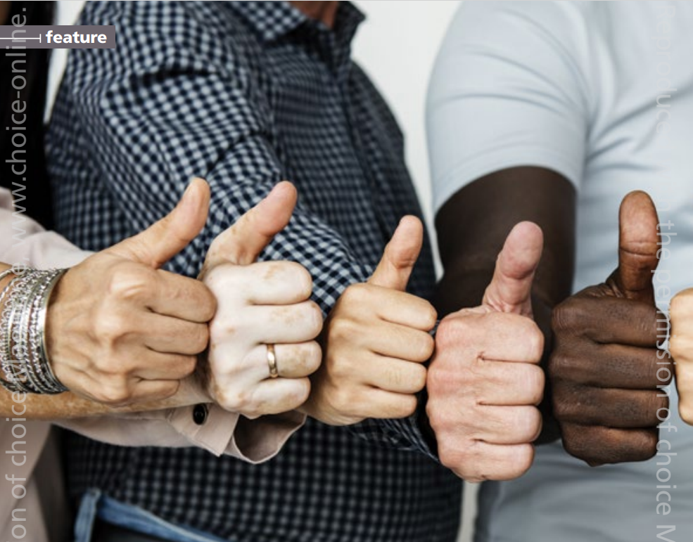 A group of people are giving each other a thumbs up