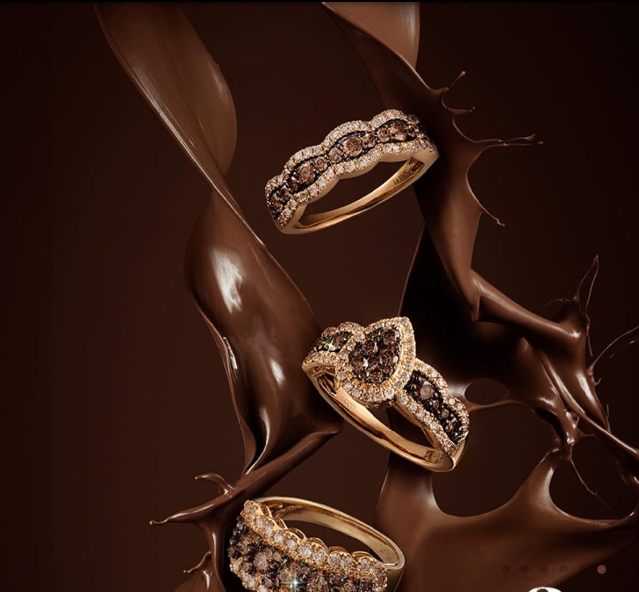 Chocolate-colored diamond rings displayed with flowing chocolate splash against a brown background.