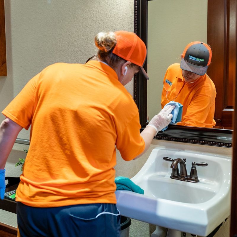 Wiping The Bathroom Mirror