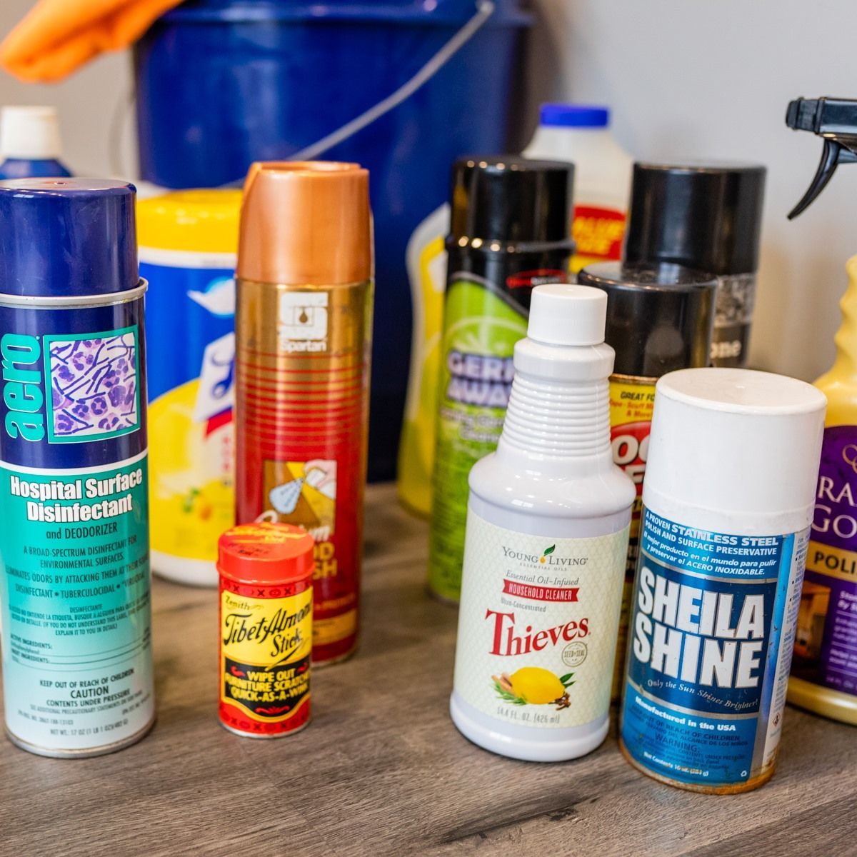 Several bottles of cleaning products including thieves and sheila shine