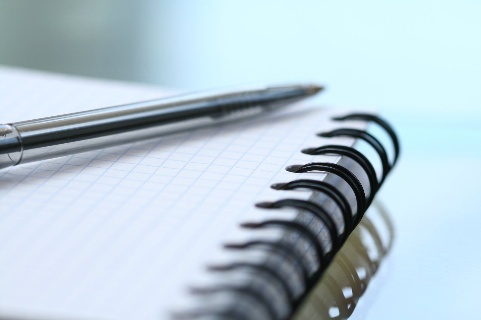 a notebook with a pen on top of it
