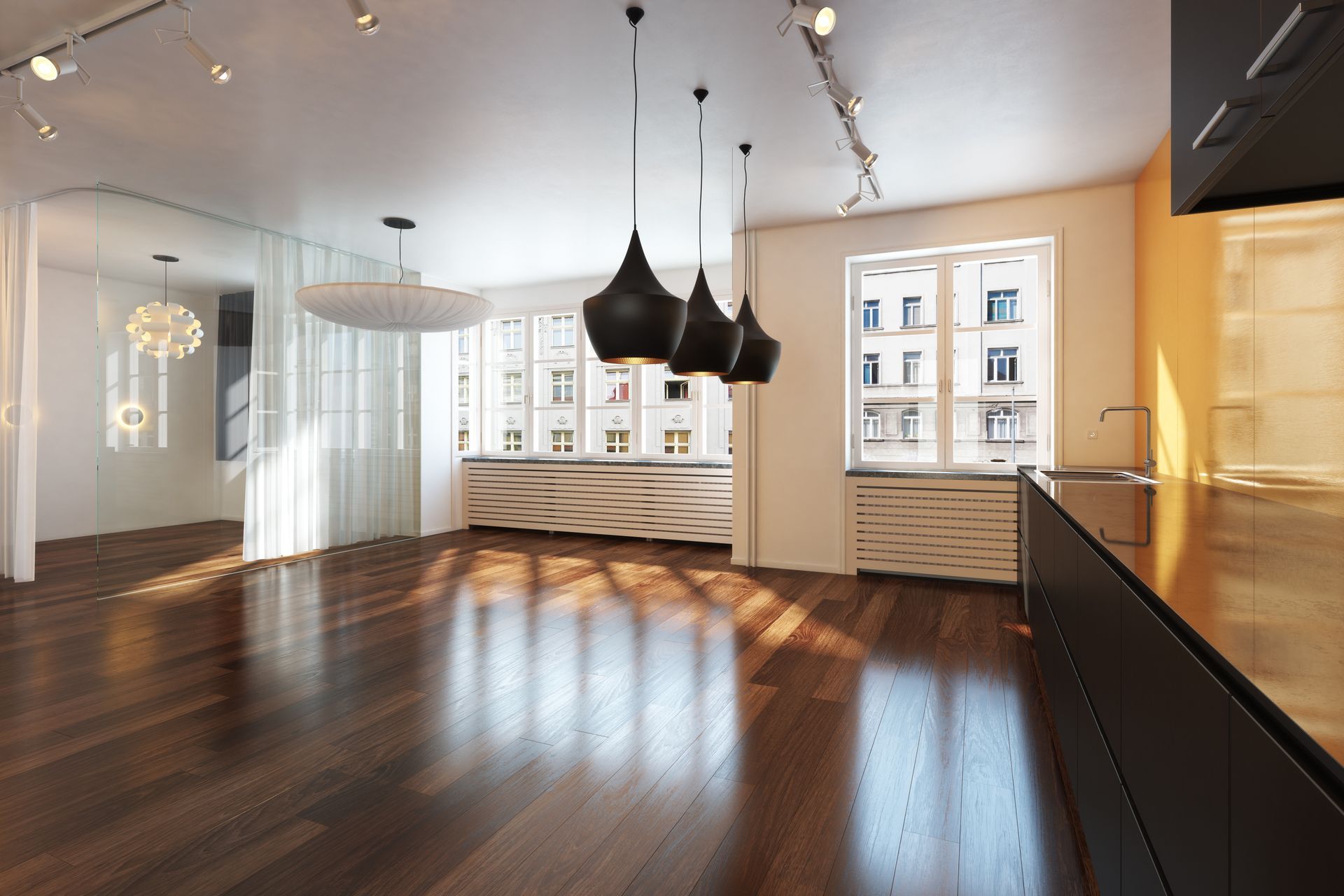 Spacious, modern living area with dark wood floors, pendant lights, and a large window overlooking a city.