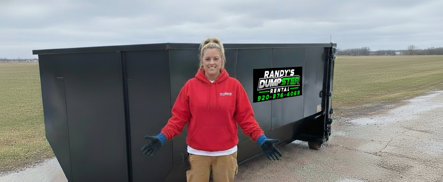Woman in red hoodie stands by a black dumpster; Randy's Dumpster Rental logo.