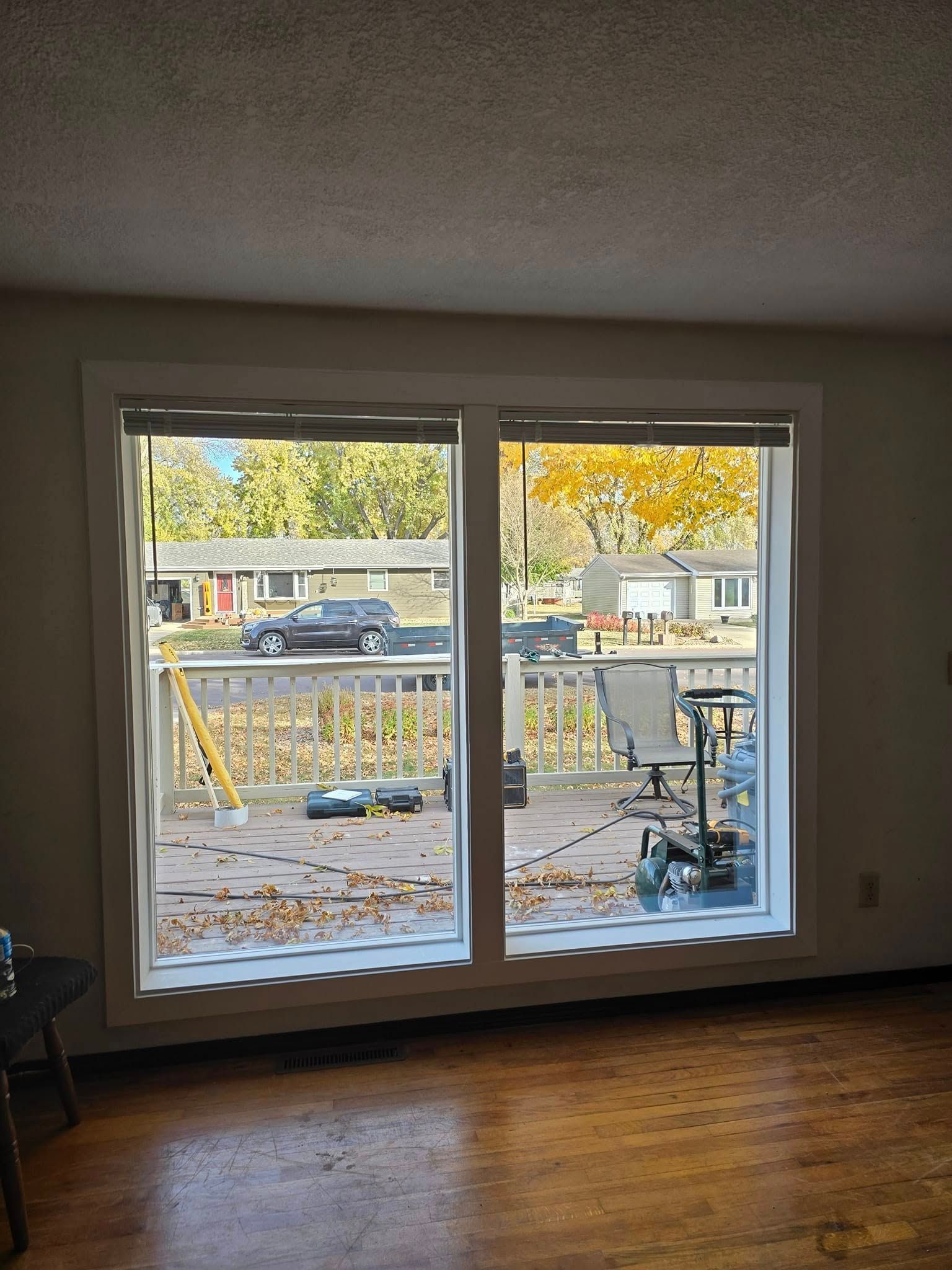 A living room with a sliding glass door leading to a deck.