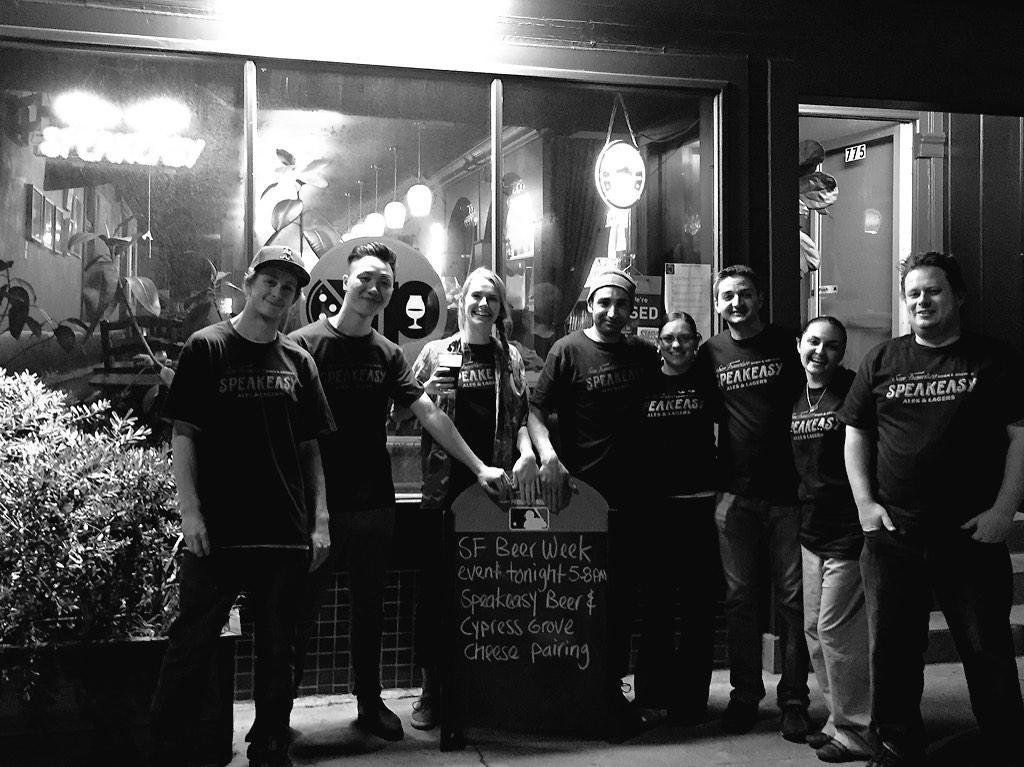 a black and white photo of a group of people standing in front Kezar Pizzetta