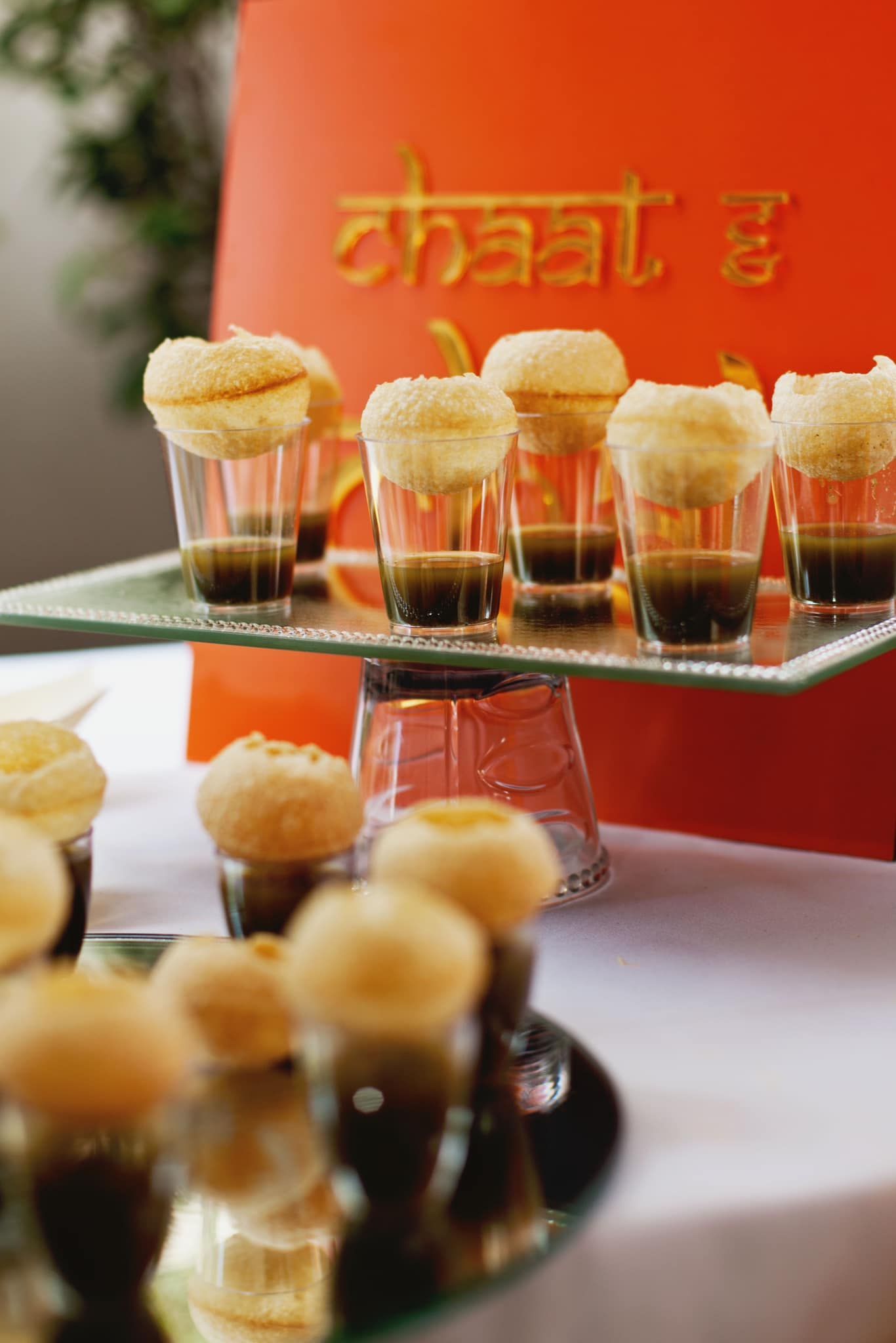 A tray of food with the word chaat in the background