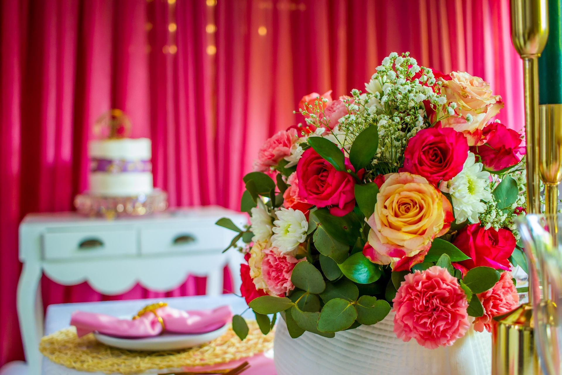 A vase filled with colorful flowers is sitting on a table.