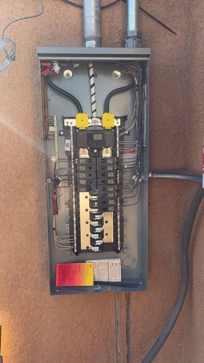 A close up of an electrical box on a wall.