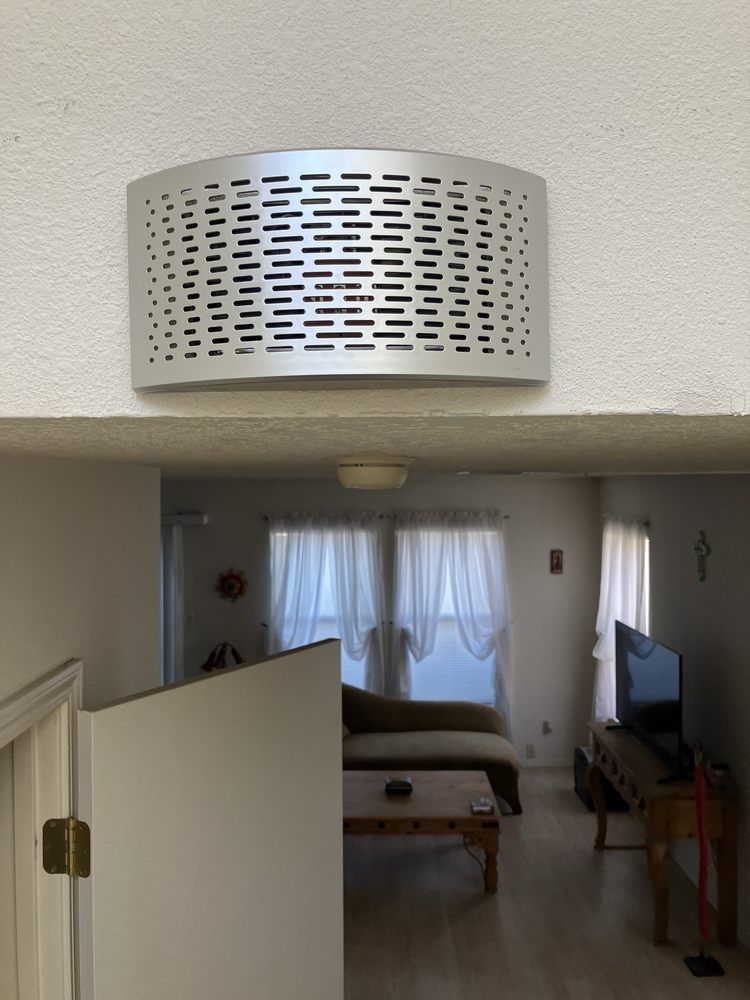 A living room with a couch and a television