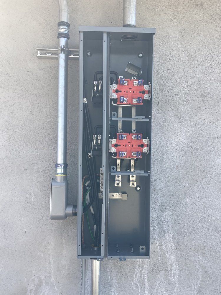 A black box with a bunch of wires coming out of it