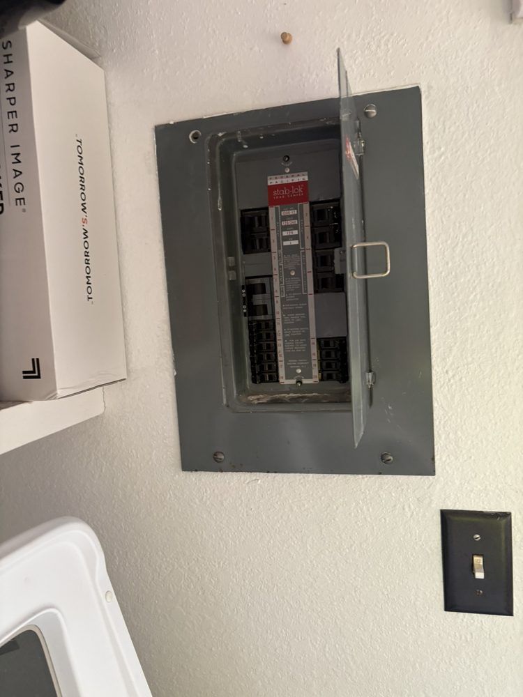 A laundry room with a box that says sharper image on it