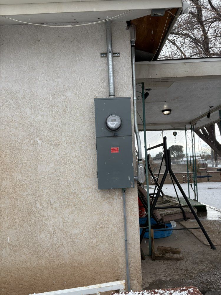A meter is mounted on the side of a building