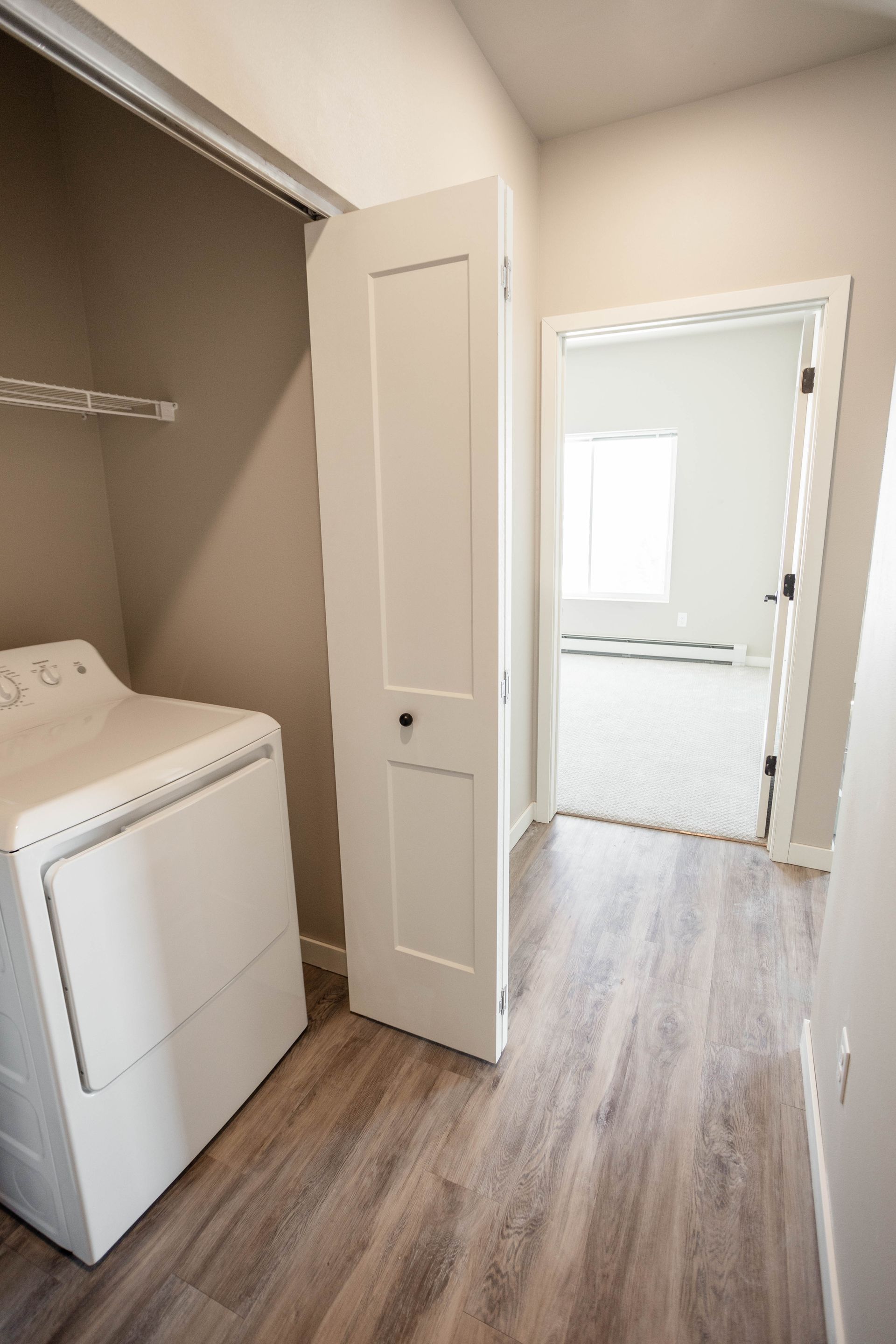 A laundry room with a washer and dryer in it.