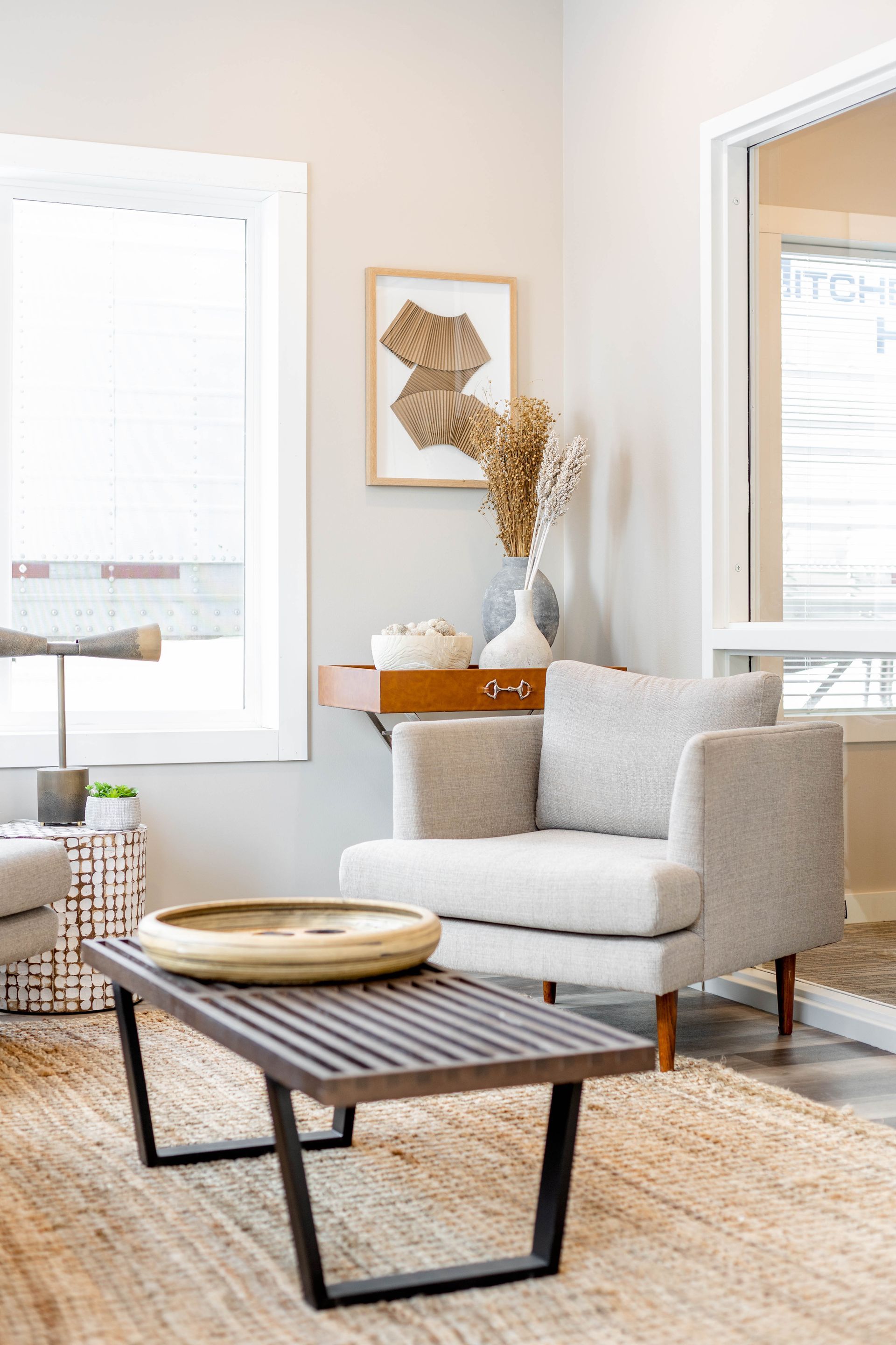A living room with a chair and a coffee table.