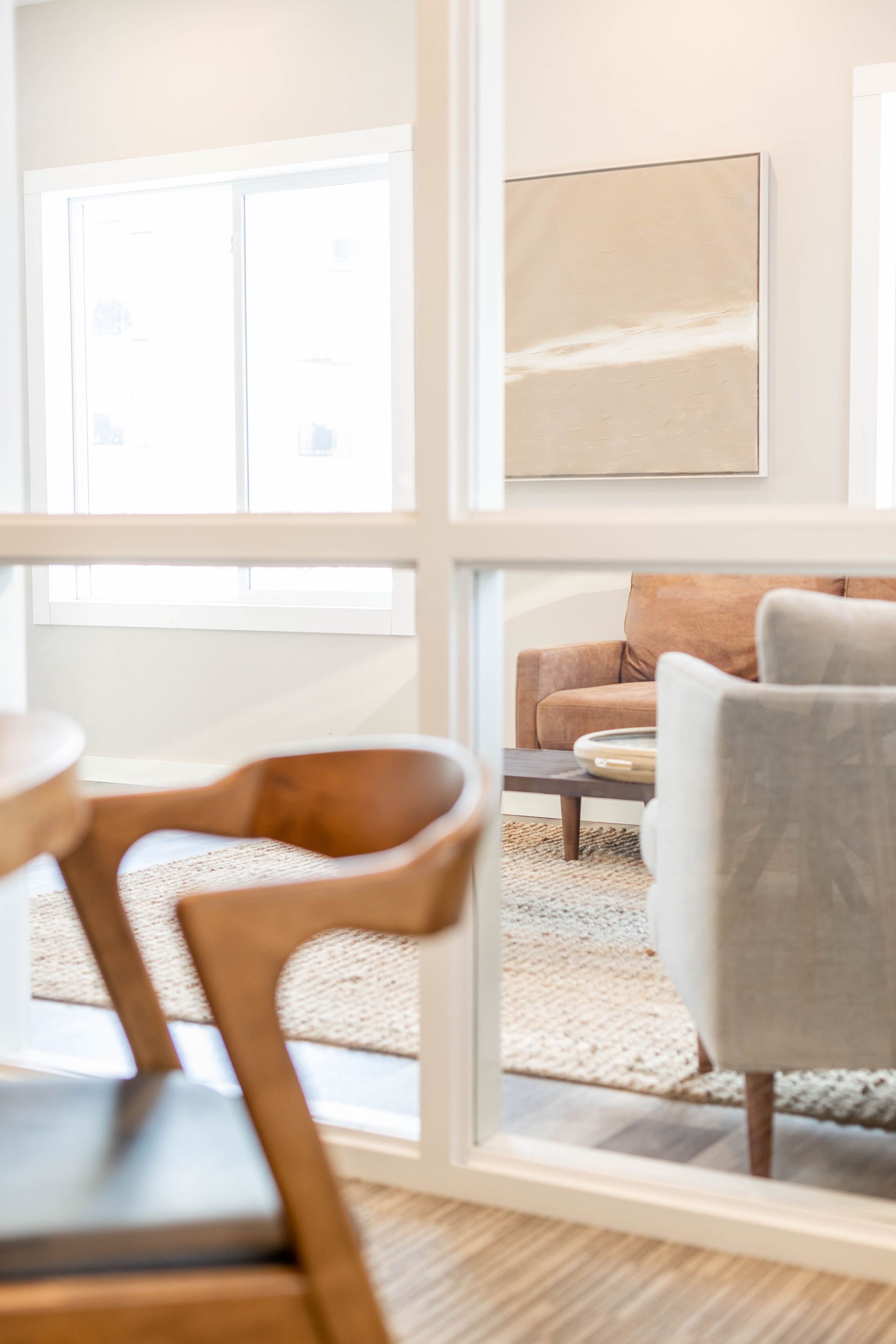 A living room with a table , chairs , and a couch.