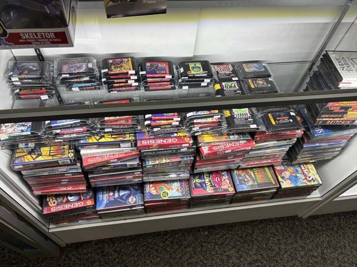 Display case of retro video games for sale.