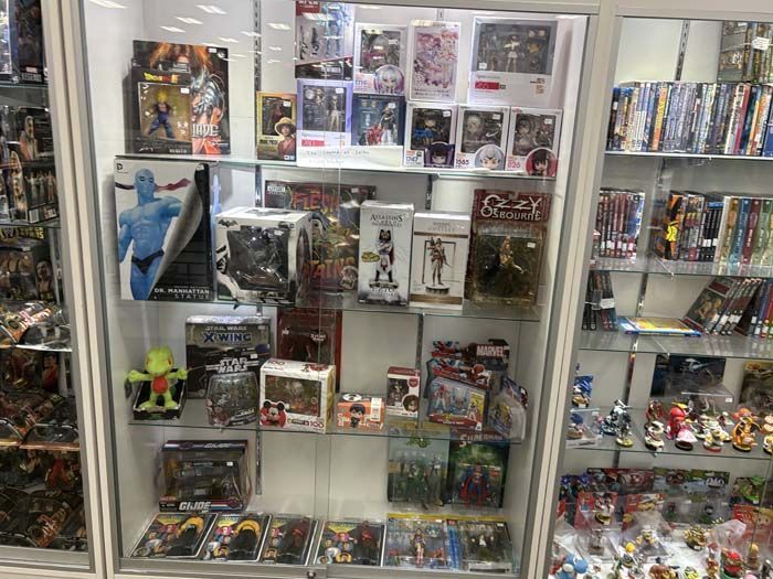 Display case filled with action figures and collectibles in a store.