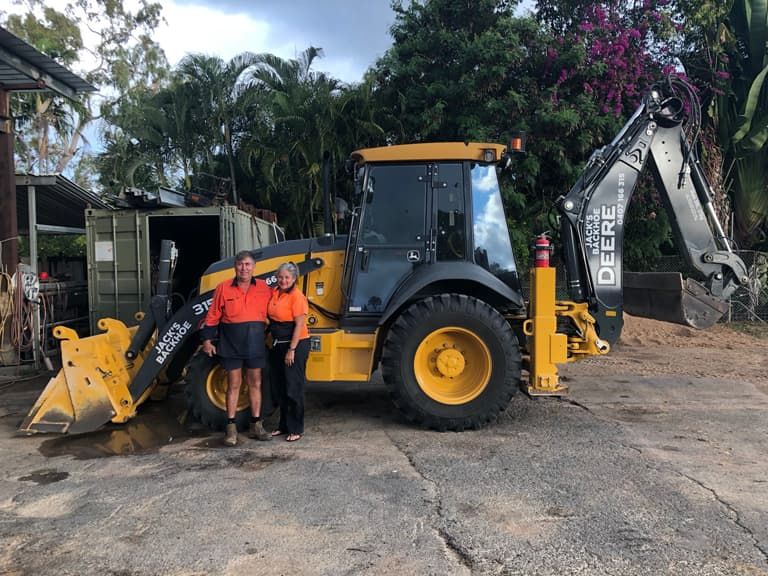 Two People on Truck at The Background - Excavator Hire Kelso, QLD