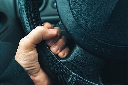 Hand Holding Steering Wheel In A Car - Detroit, MI - Frederic M Rosen, PC Attorney At Law