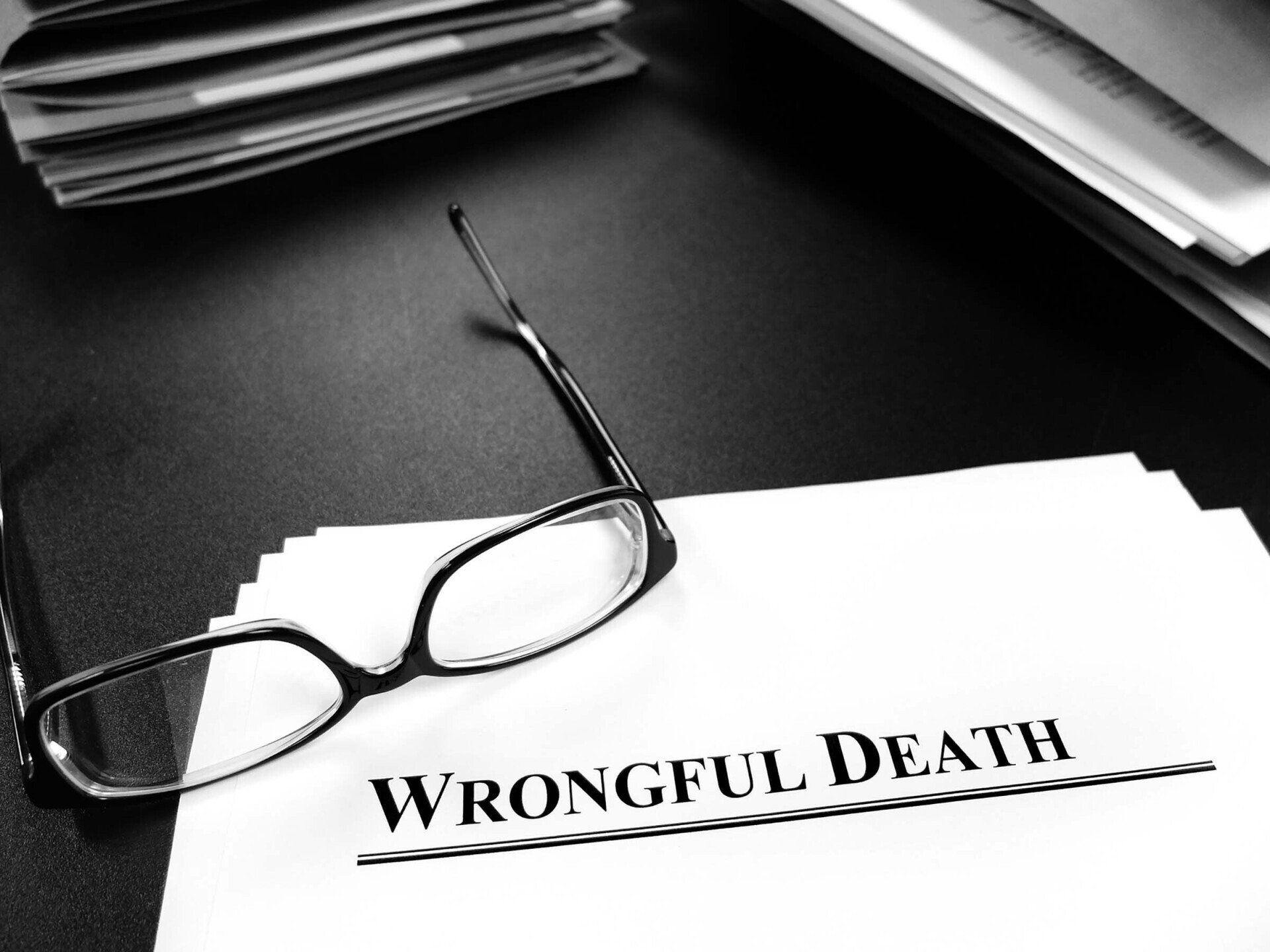 Wrongful Death Papers On Desk For Lawsuit With Glasses - Detroit, MI - Frederic M Rosen, PC Attorney At Law