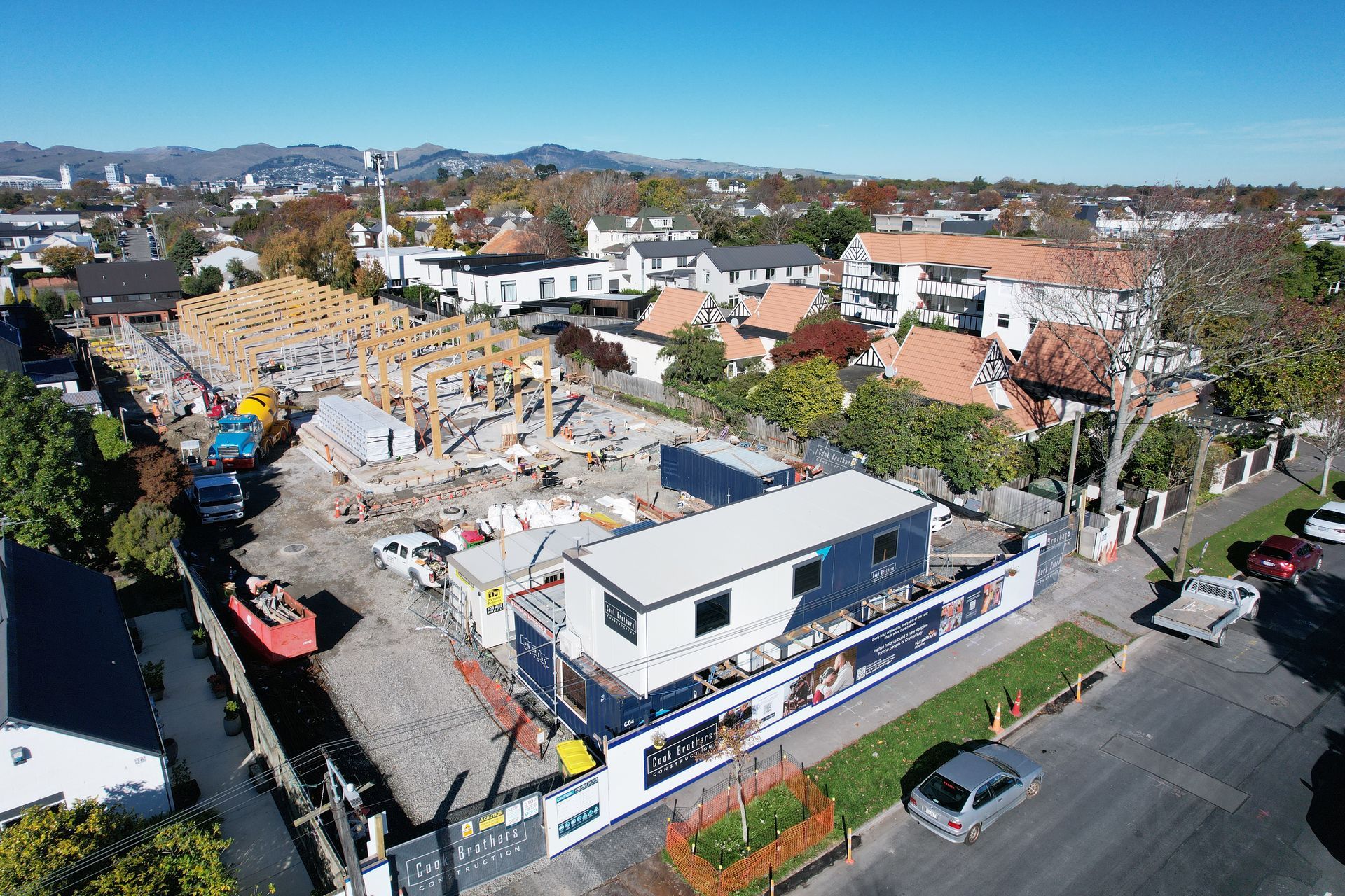 A building site with a crane in a semi residential area
